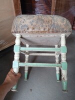 Old, cheerfully colored seat, 50 cm high, for home decoration.