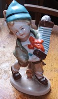 Porcelain figure of a child with a German tango accordion