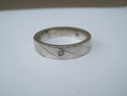 Men's silver ring with a small stone, linear decoration