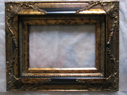 Richly decorated, special picture frame made with rich gilding