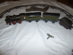 Old tin Marklin clockwork toy railway locomotive with passenger cars