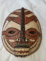Carved wooden mask can be negotiated from a special collection