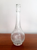 Old brown glass liquor bottle with convex inscription