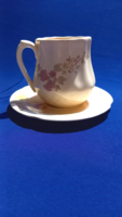 Ceramic mug with a flower pattern on the bottom