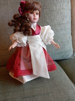 Porcelain doll, in undamaged condition, with a stand. 30 cm