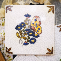 Vintage Gmunden decorative tile with a butterfly pattern