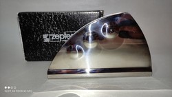 Zepter in a metal napkin holder box