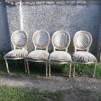 4 baroque chairs with a zebra pattern.