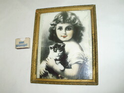Old glazed picture frame with a picture of a little girl with a kitten