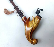 Graceful antique pipe with stem
