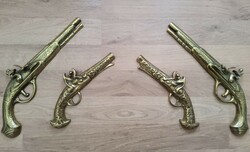 Brass weapons. Wall decoration
