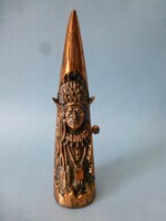 A rare red copper table lighter in the shape of a bison horn, depicting an Indian shaman