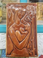 Ceramic image of a mother with her children
