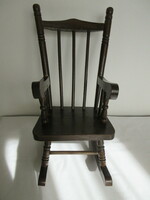 Old carved wooden baby rocking chair.