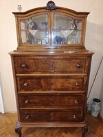 Small glass cabinet with four drawers