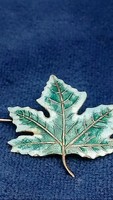 Brooch in the shape of a maple leaf decorated with antique Canadian silver enamel