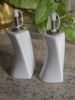 Shaped porcelain holding oil and vinegar, in a pair 17 cm