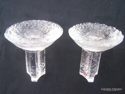 A pair of Orrefors candle holders is a product of the world-famous Swedish glass manufactory. 