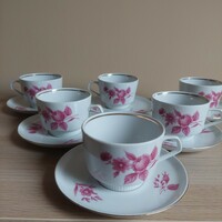 A set of coffee cappuccino cups with a floral pattern