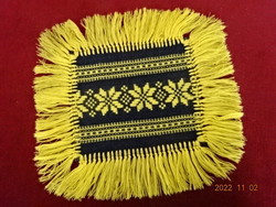 Embroidered black placemat with yellow fringe and embroidery. He has! Jokai.