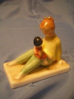 U4 art deco statue of the family rarity girl or mother with baby sitting on a pedestal