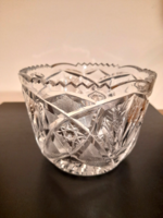 An antique crystal table centerpiece with a beautiful polished pattern