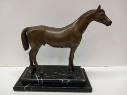 Antique bronze horse statue on a marble base