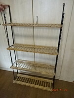 Wrought iron wall shelf with wicker cane shelves. His height is 123 cm. He has! Jokai.