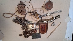 A collection of mixed trinkets and watches.