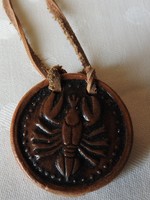 Cancer ceramic pendant on a leather strap
