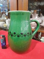 Old ceramic mug, straw, jug, flask.