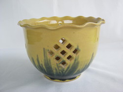 Glazed ceramic bowl with a yellow-green pattern