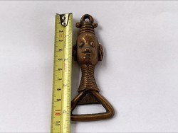 Copper beer opener depicting a Padaung tribal woman with a long neck
