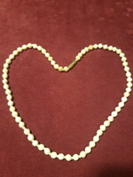 Short string of beads carved from bone - 44 cm