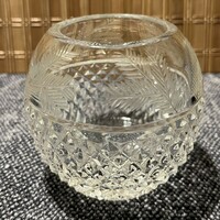 A small, spherical crystal vase with a pine branch pattern