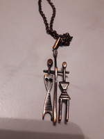 John Percz necklace with pendant.