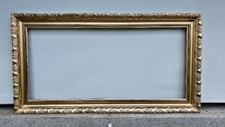( W) 55x 104 cm.- Es, wonderful, antique, gold-colored, special mirror with blonde frame.