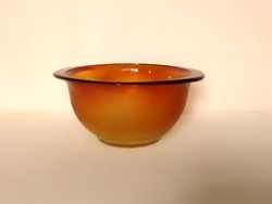Old amber-colored heat-resistant deep bowl for salad and soup