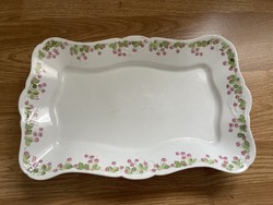 Antique porcelain bowl with wild rose and cookies.