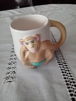 Ceramic mug / cup in relief with a nice, cheeky monkey decoration