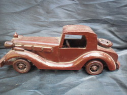Carved from wood, old timer car, richly detailed, painted in color. Rare piece with 
