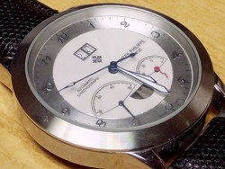 Patek philippe geneve automatic chronograph in steel case with leather strap. In new condition.