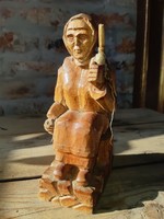 Wooden statue of a peasant woman