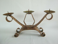 Copper ornate three-pronged candlestick