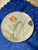 Antique majolica wall plate with tulip decoration 20 cm.