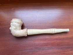 Human-headed pipe with stem