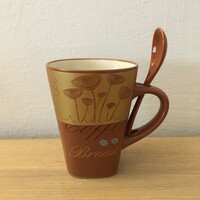 Brown coffee mug with spoon