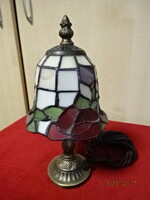 Tiffany glass table lamp with bronze base. He has! Jokai.