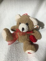 Small, new teddy bear with heart, original label
