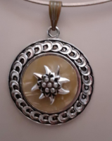 Retro silver-colored decorative round pendant in the middle adorned with a mountain wool